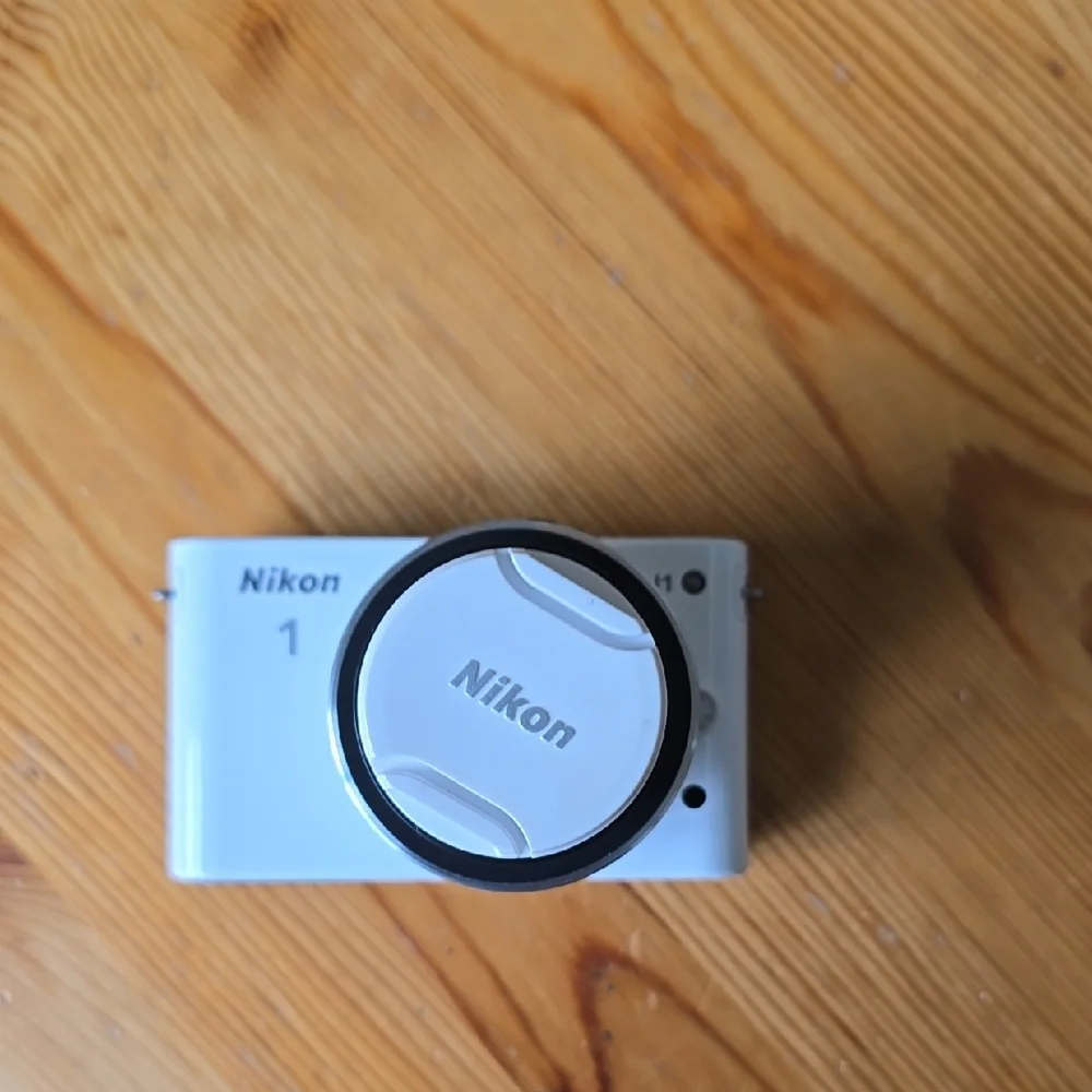 Compact Silver Camera with Accessories